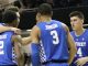 Kentucky basketball players huddle