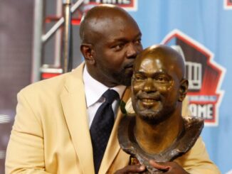 07 August 2010: Dallas Cowboys running back Emmitt Smith poses with his plaque following his induction into the Pro Football Hall Of Fame in Canton, Ohio.